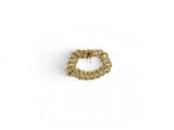 a close up of a gold chain ring on a white background