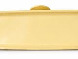 yellow leather box with lid on white background with clippings