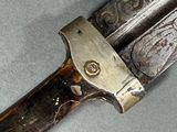 a close up of a knife on a table