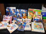 a pile of toys and games on a table
