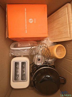 a box with a bunch of kitchen items inside of it