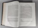 an open book that is sitting on a table