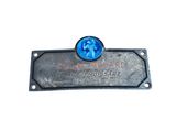 the plaque is made of metal and has a picture of a dog on it