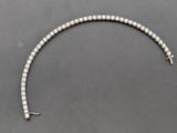an old silver bracelet with a cross on it
