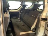 a seat in the back of a van with a black seat cover