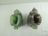 two pieces of artichoke sitting on a white surface
