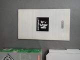 a box of nintendo wii controllers next to a box of nintendo wii controllers