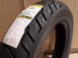 a close up of a motorcycle tire with a sticker on it
