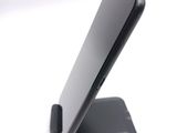 a cell phone that is sitting on top of a stand