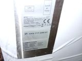 a white refrigerator with a brown door and a brown handle
