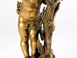 an image of a statue of a cupid holding a branch of a tree