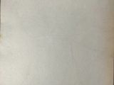 an old piece of paper sitting on top of a table
