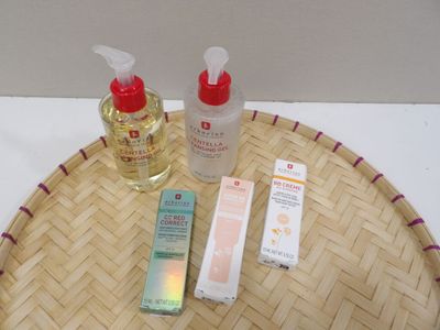 a bamboo tray with a bottle of lotion and a bottle of lotion on it
