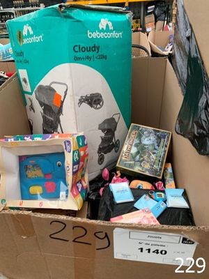 a cardboard box filled with toys and books in a store