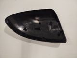 a black plate with holes in it on a white surface