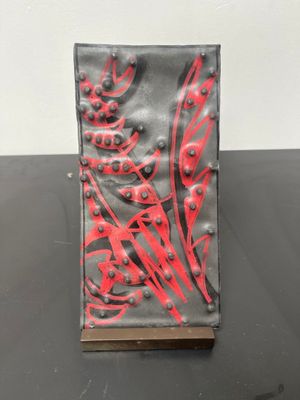 a black and red book sitting on a table