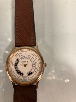 a watch that is sitting on a glass table