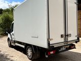 a white truck parked in front of a building