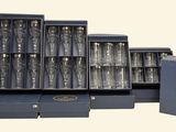 a lot of silverware in a box on the table
