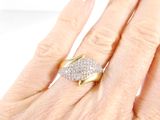 a woman ' s hand with a diamond ring on it
