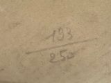 a picture of a number on the sidewalk of a building