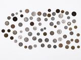a group of coins are arranged in a circle on a white surface