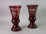 two vases that are sitting next to each other on a table