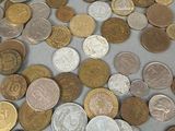 a lot of coins that are on the table