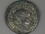 a close up of a coin with a woman ' s face on it