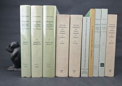 several books are stacked on top of each other on a table