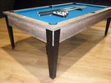 a pool table with a blue cloth on it