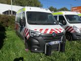 three ambulances parked in a row on the grass