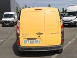 a yellow van that is parked in a parking lot