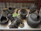 a tray that has a lot of old pots and pans on it