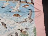ducks flying over a body of water on a pink background