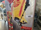 une boîte sur laquelle est posé un aspirateur jaune et rouge