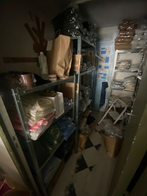 a room with a lot of stuff on the shelves