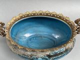 a blue bowl that is sitting on a table