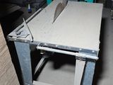 a table that has a saw on it in a room