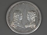an image of a coin with a picture of a man and a woman on it