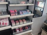 a lot of cosmetics products on the shelves in the store