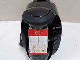 a coffee maker that is sitting on a table