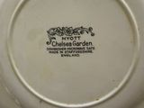a white plate with a black and white design on it