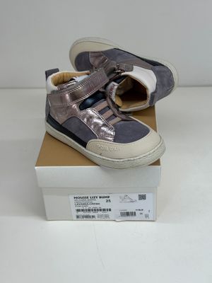 a box with a pair of shoes on top of it