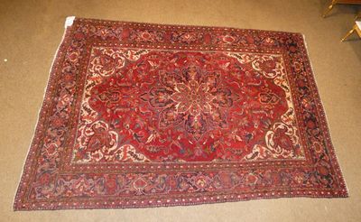 rug on the floor in a room with a chair and a table