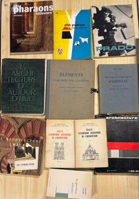 several books are sitting on a table next to each other