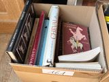 a box full of books sitting on the floor