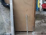 a pile of cardboard sitting on the ground in a garage