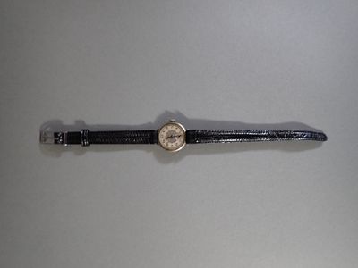 an image of a watch sitting on top of a white table