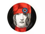a picture of a plate with a picture of a man wearing a red hat